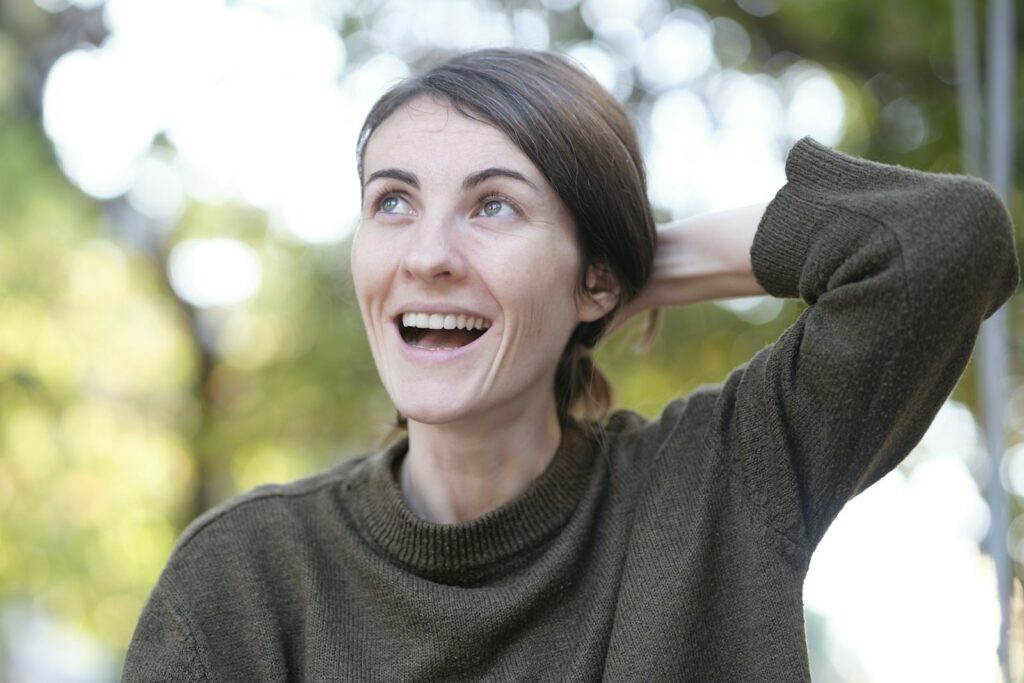 Woman laughing outdoors
